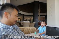 Darwin plays with cars as daddy uses computer at Ocean Coral & Turquesa lobby.jpg