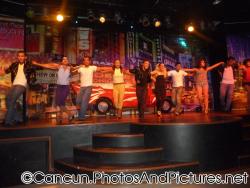 Dancers put arms on each others' shoulders at Ocean Coral & Turquesa show.jpg