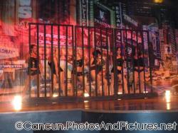 Women in black shorts and tops dance on stage at Ocean Coral & Turquesa.jpg
