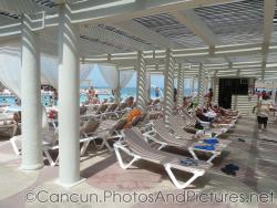 Beach chairs next to pool at Crown Paradise resort next to GR Solaris.jpg