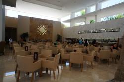 Bar area with plenty of chairs and tables at Bahia Principe Sian Kaan lobby.jpg