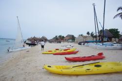Canoes and paddles and sailboats next to Gran Bahia Principe Sian Kaan private beach.jpg