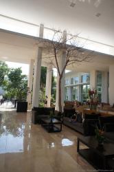 Chairs and tree inside lobby of Gran Bahia Principe Sian Kaan.jpg