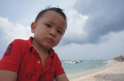 Darwin at Gran Bahia Principe Sian Kaan private beach looking less unhappy.jpg