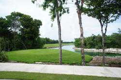 Grand Bahia Principe Sian Kaan Golf course hole next to pond.jpg