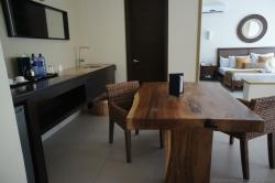 Natural wooden table and sink at Bahia Principe Sian Kaan junior suite.jpg