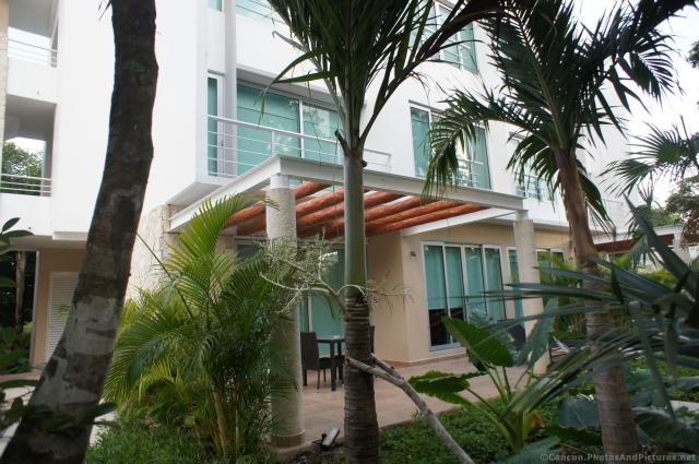 Outdoor patio of a Gran Bahia Principe Sian Kaan villa hotel.jpg