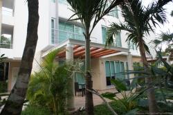Outdoor patio of a Gran Bahia Principe Sian Kaan villa hotel.jpg