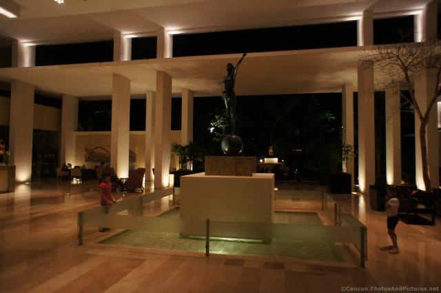 Statue inside Gran Bahia Sian Kaan lobby at night.jpg