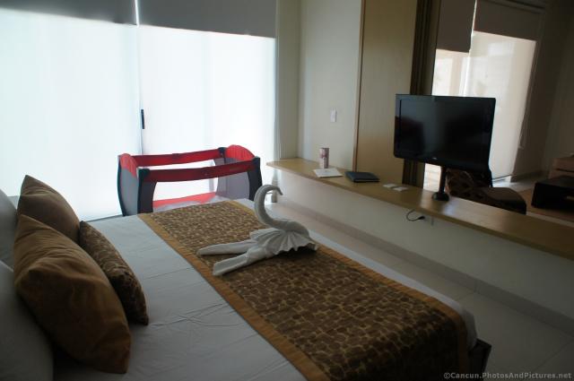 Swan towel animal on bed at Bahia Principe Sian Kaan hotel room.jpg