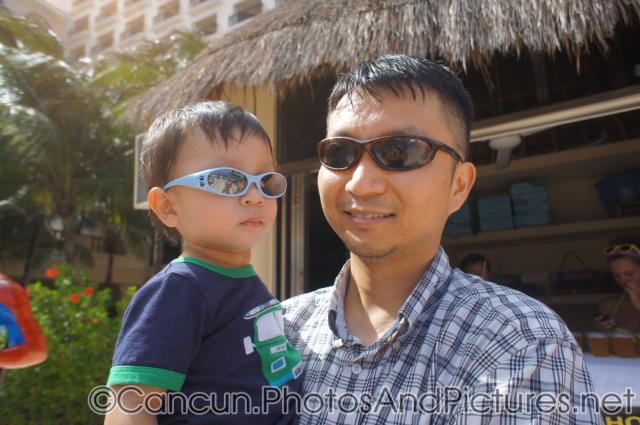 Darwin and daddy waring sunglasses at GR Solaris.jpg