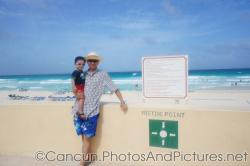 Darwin and Daddy with ocean behind in GR Solaris Cancun.jpg