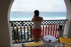 Darwin and mommy look on from the balcony of GR Solaris ocean view room.jpg