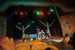 Performers in costumes and stilts perform on stage at Gran Bahia Principe Akumal theater.jpg