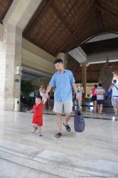 Darwin holds daddy's hand at Gran Bahia Principe Akumal lobby.jpg