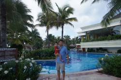 Darwin held by Daddy in front of pool at Gran Bahia Principe Akumal.jpg