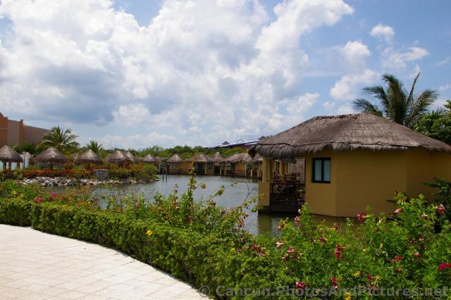 Riverfront Hotel Room Huts at Grand Palladium Kantenah.jpg