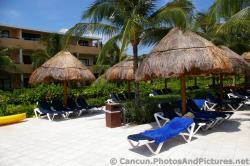 Pool chairs in front of Guest Units at Grand Palladium Kantenah.jpg