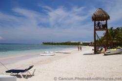 People walking on the beach near the Lifeguard Tower Grand Palladium Kantenah.jpg