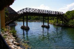 Bridge going over Grand Palladium White Sand Lagoon.jpg