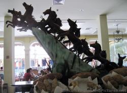 Ponies going off Cliff Statue inside Grand Palladium Riviera Buffet Restaurant.jpg
