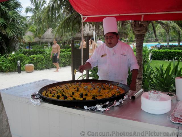 Chef Cooking up Paella Outdoors Grand Palladium Riviera Maya.jpg