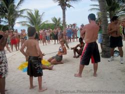 Guests play How Low Can You Go at the beach Grand Palladium Riviera Maya.jpg