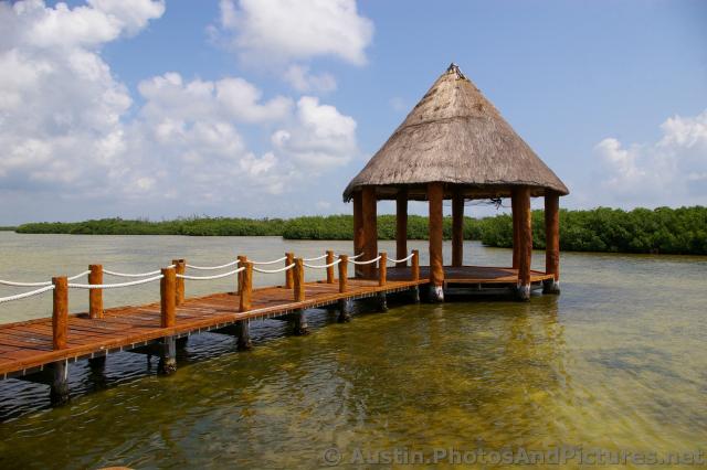 Pavillion with cone shape straw top at the Playa Mujeres lagoon.jpg