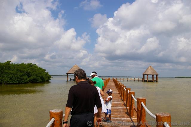 Bridge to two pavilions at the Playa Mujeres lagoon area.jpg