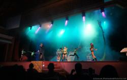 Dancers and singers perform on stage at Performers on stage in cat costumes at Gran Bahia Principe Coba theater show.jpg