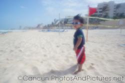 Darwin looks on while standing at the beach at GR Solaris Cancun.jpg