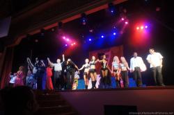 Performers come out for a bow at the end of Performers on stage in cat costumes at Gran Bahia Principe Coba theater show.jpg
