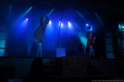 Performers in elaborate costumes on stage at Gran Bahia Coba theater.jpg