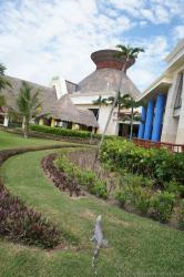 An iguana looks towards the lobby of Grand Bahia Principe Tulum.jpg