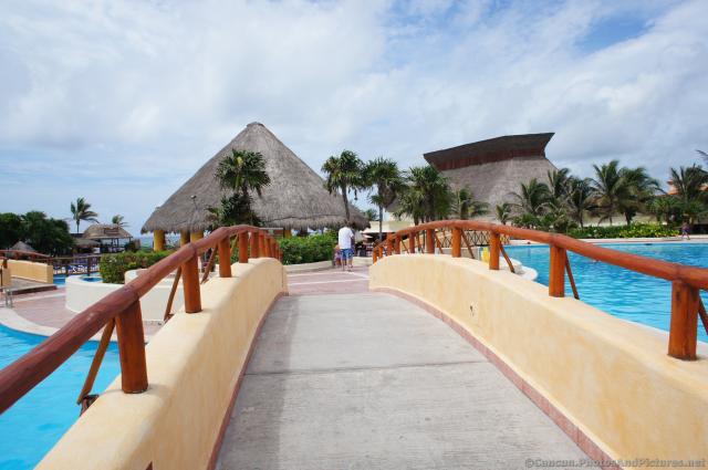Pool crossing bridge at Grand Bahia Principe Tulum.jpg