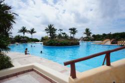 Pool with circular island of plants and trees at Grand Bahia Principe Tulum.jpg
