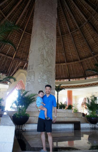 Darwin held by daddy at Grand Bahia Principe Tulum lobby.jpg