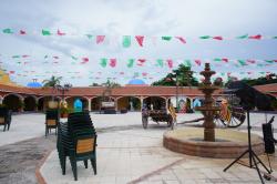 Fountain and cart at courtyard of Hacienda Dona Isabel Gran Bahia Principe.jpg