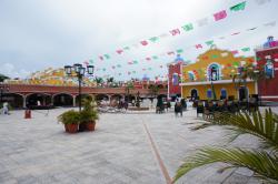 Hanging flags at central courtyard for Hacienda Dona Isabel Gran Bahia Principe.jpg