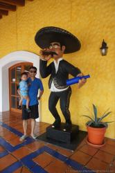Darwin and daddy next to Mexican in sombrero statue at Hacienda Dona Isabel Gran Bahia Principe.jpg