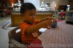 Darwin plays with toy car at GR Solaris Marco Polo restaurant.jpg