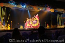 Four women in long colorful skirt costume perform in show at GR Solaris.jpg
