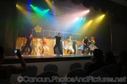 Male and female dancers perform in costumes at GR Solaris theater.jpg