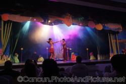 Two dancers perform on stage at GR Solaris show.jpg