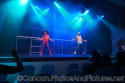 Woman dancer in tight purple pants and a male performer dance on stage at GR Solaris.jpg