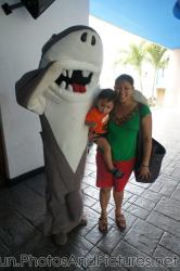 Darwin being held by mommy standing next to Shark mascot for Cancun Interactive Aquarium at La Isla Shopping Village in Cancun.j