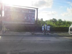 Playa del Carmen sign and people walking.jpg