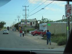 Mexicans walking along a street in Playa del Carmen.jpg