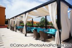 Cloth drape covered seats at Ocean Coral & Turquesa lobby patio.jpg