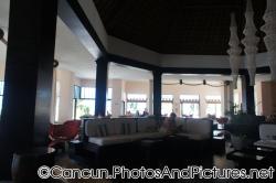Dark wood seating area and flooring at lobby of Ocean Coral & Turquesa.jpg